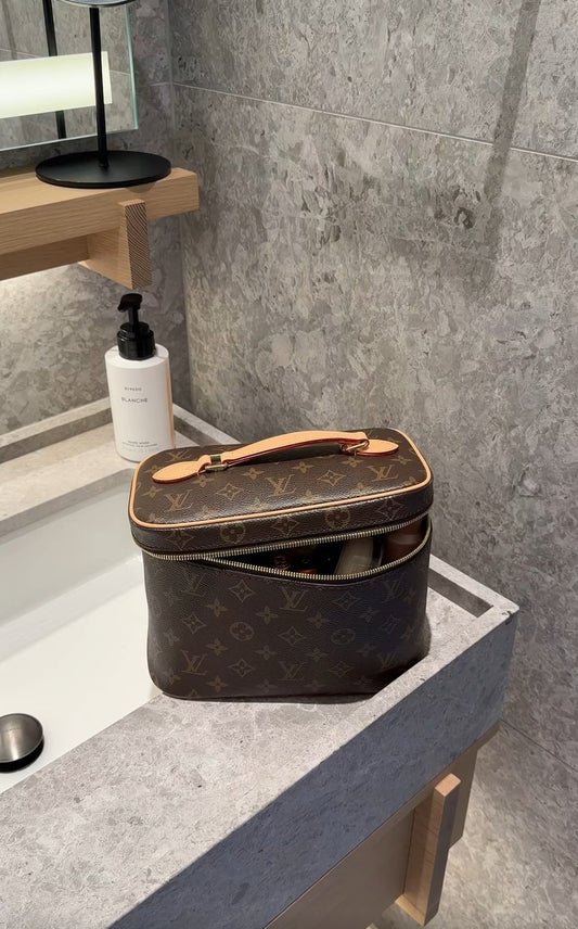 louis vuitton makeup bag on counter top bathroom